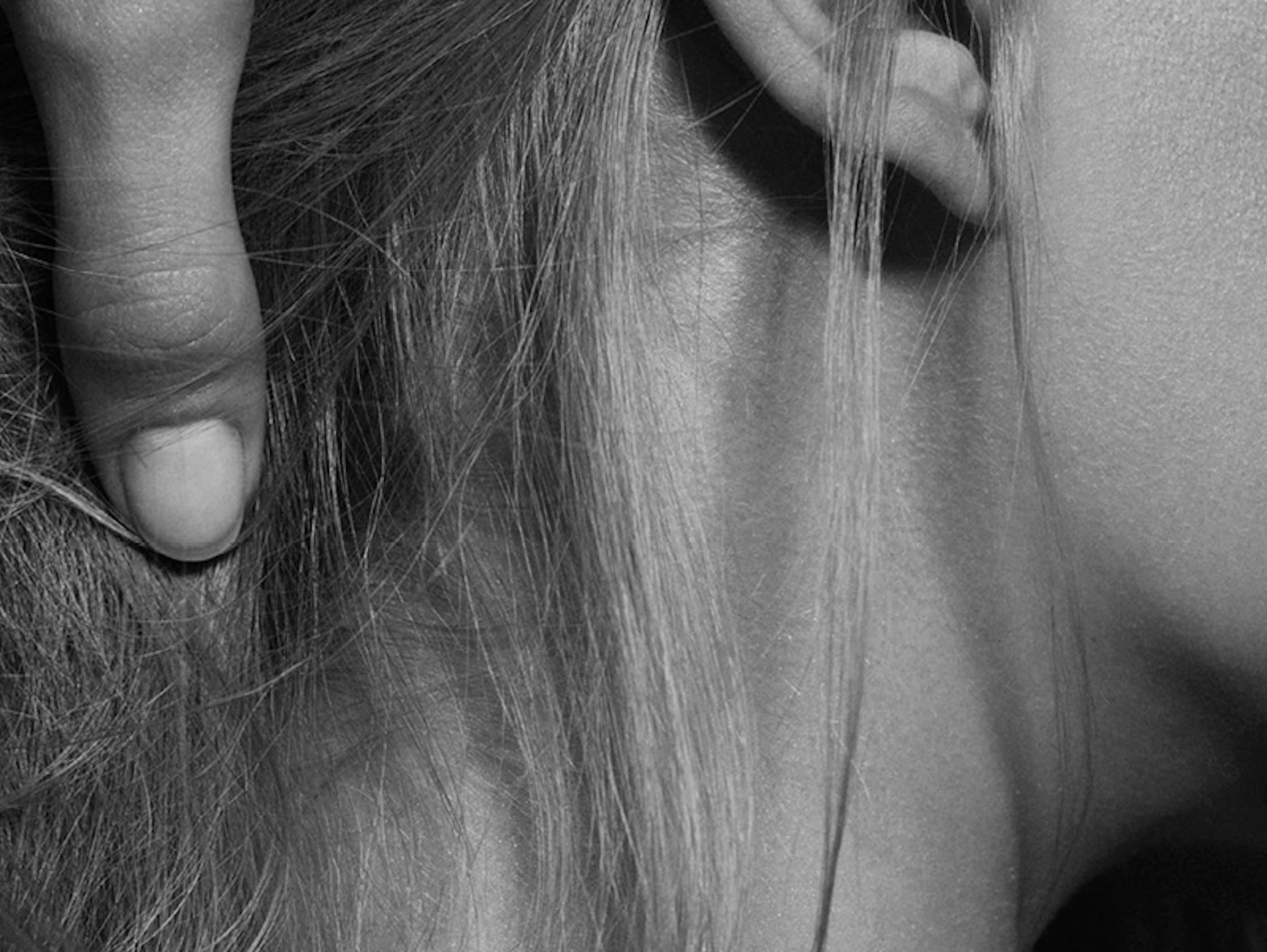 Close-up of scalp and hair being examined